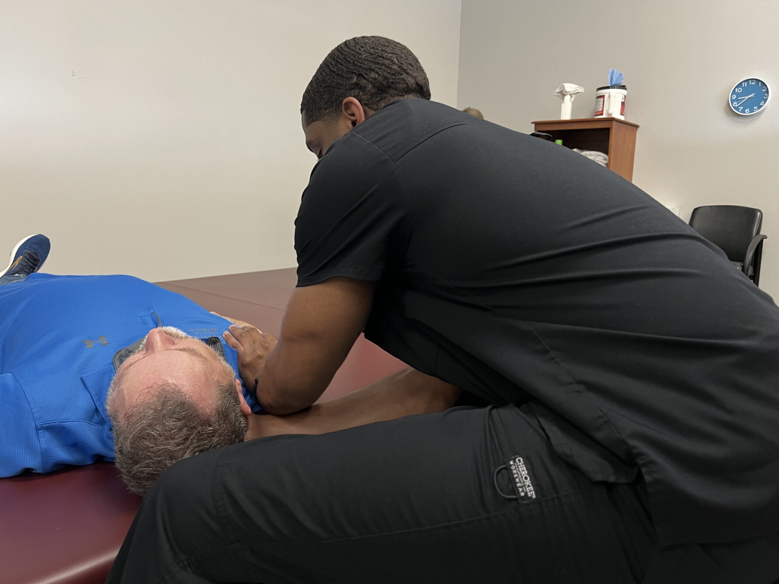 Chiropractic spinal adjustment therapy for male patient